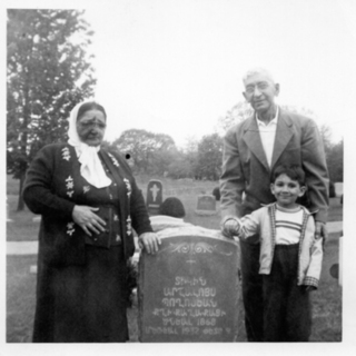 Zaruhi Boghosian-Harabedian from Keghi at her mothers grave in Whitinsville, MA 1954 or 55. With husband Garabed and grandson Kenny Martin-Edit.jpg