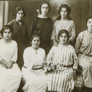 1 Siranoush Manassian in orphanage  clothing, back row right.jpg